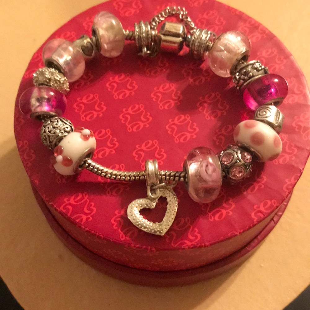 Pink and silver colored charm bracelet